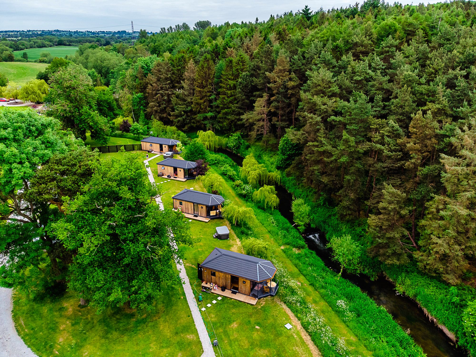 Birds eye view of riverside cabins