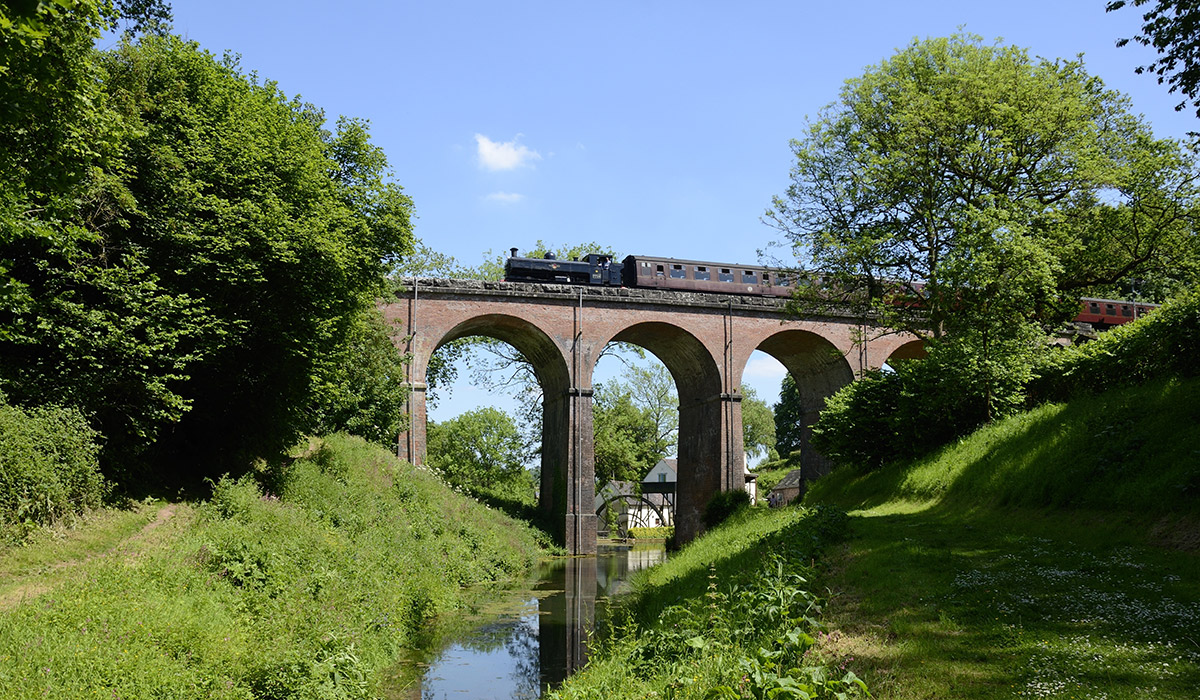 Train going over bridge above river | Severn Valley Railway | Visit Shropshire